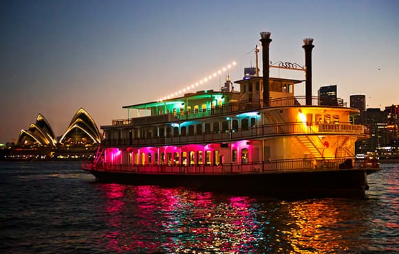 Experience the best sights of the harbour from the wrap-around verandah of the glamorous Showboat