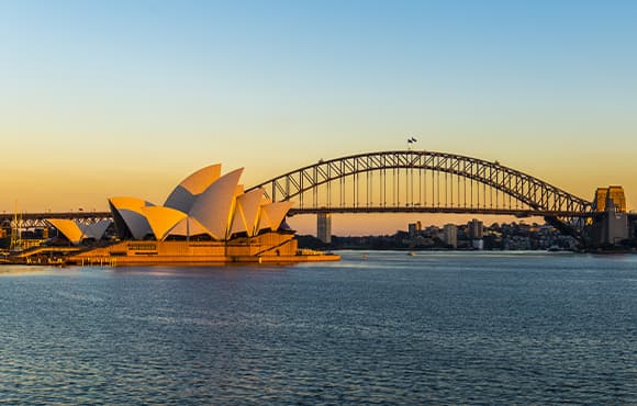 Watch the harbour icons at its gloaming best aboard a sunset dinner cruise on Sydney Harbour.